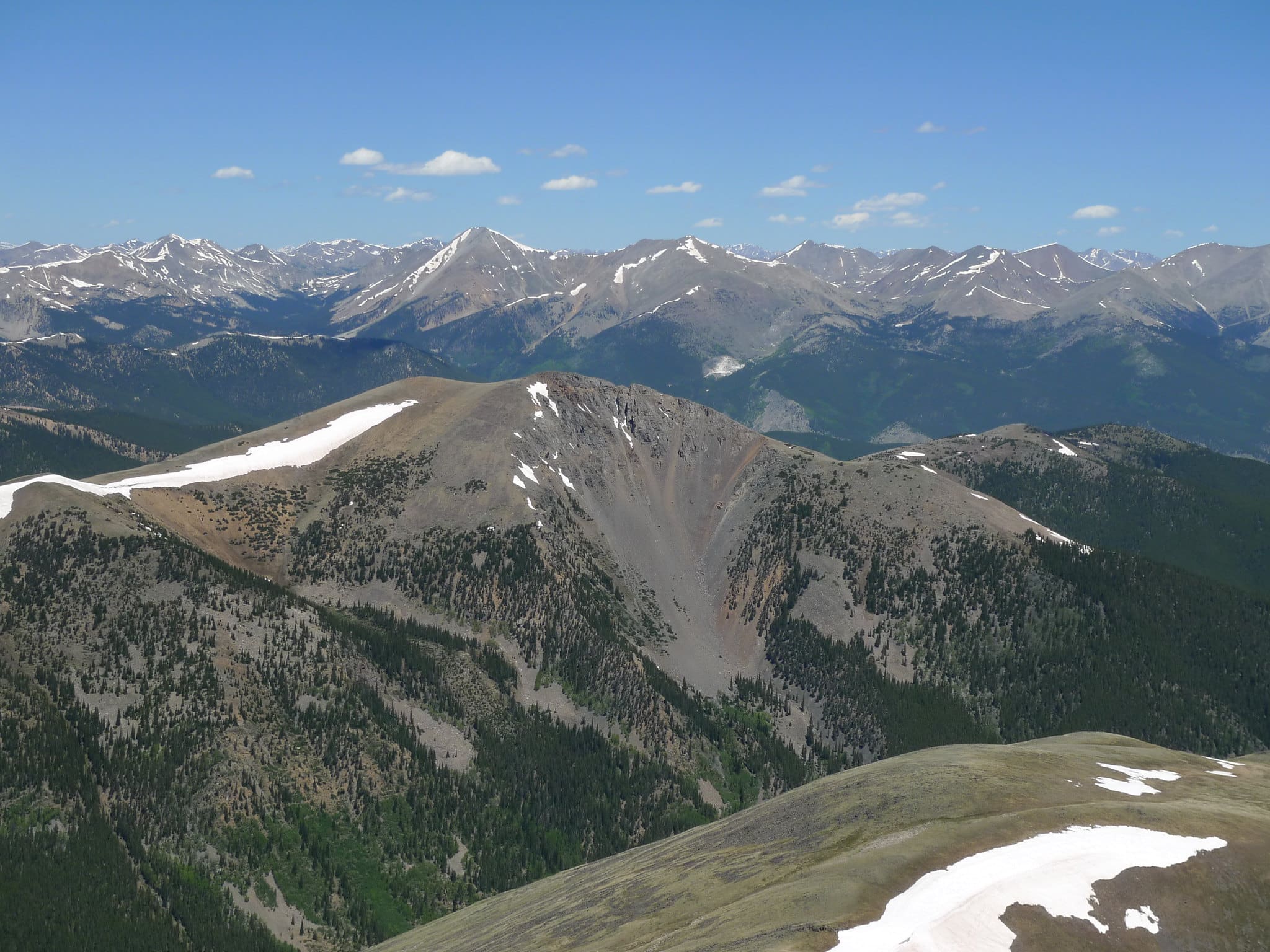 High-elevation views of mountain range on a clear blue skies day