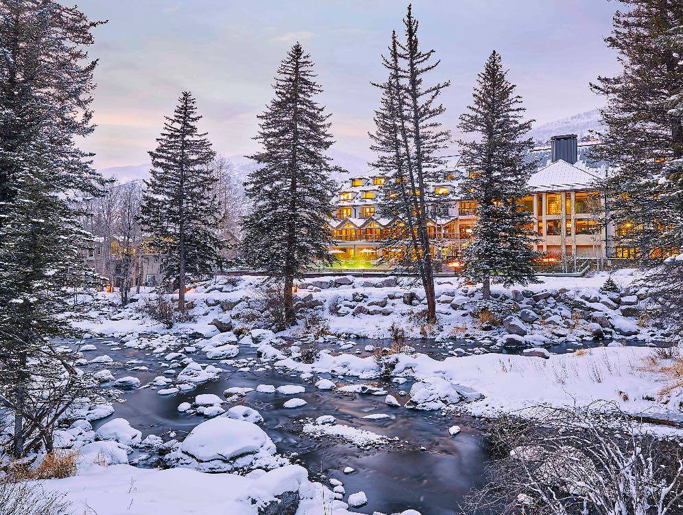 Snow covered landscape by Gore Creek and Grand Hyatt Vail, Colorado