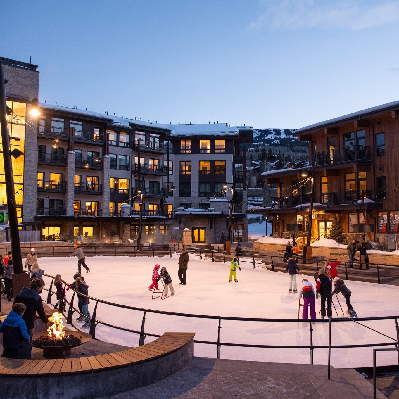 Winter ice skaters at the Snowmass Base Village Plaza Ice Rink Colorado