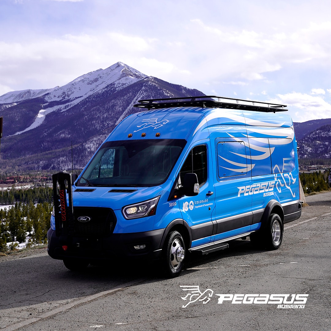 A blue Pegasus shuttle bus from Bustang Colorado