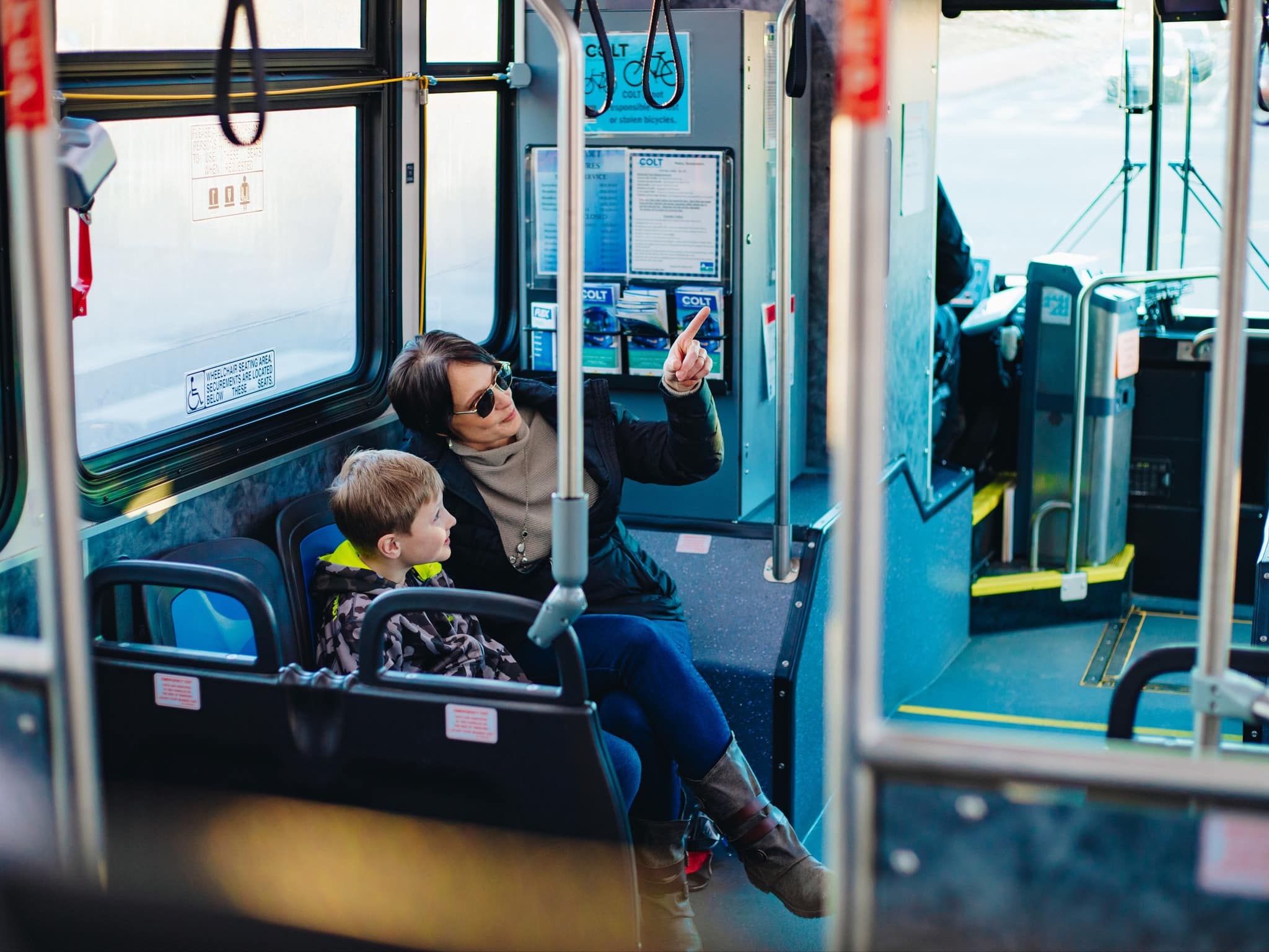 Parent and child on a City of Loveland Transit (COLT) bus