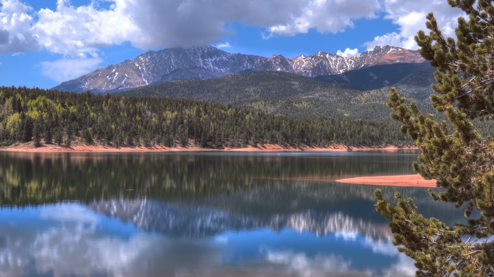 Crystal Reservoir in spring with Pikes Peak behind it Colorado