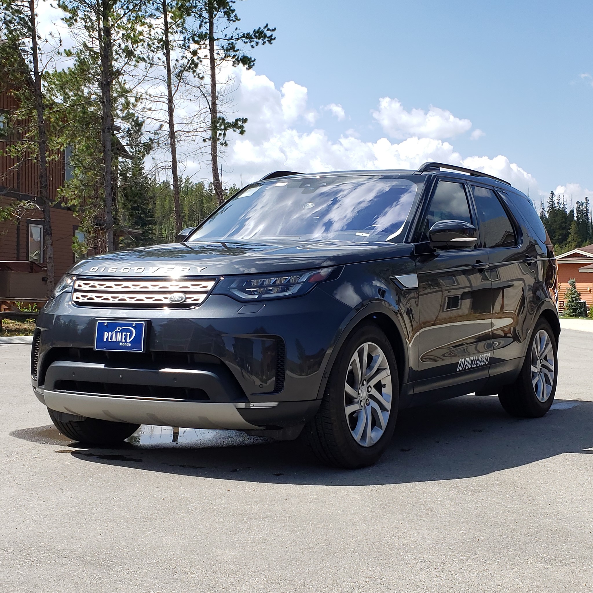 Black Grand Mountain Ride SUV parked on the pavement.