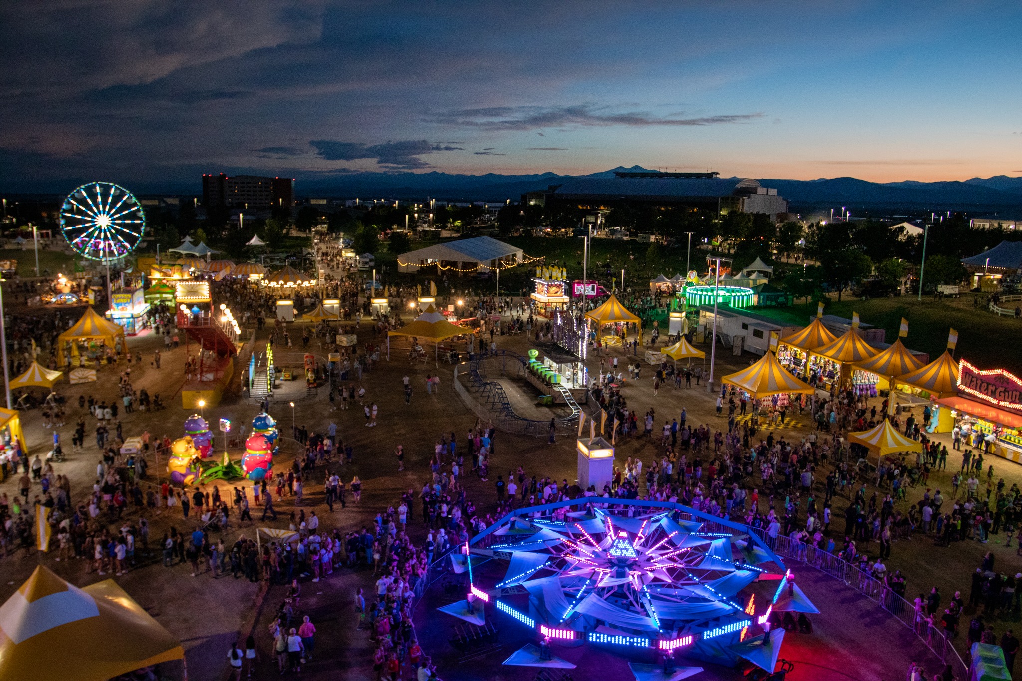 Carnival rides lit up at night