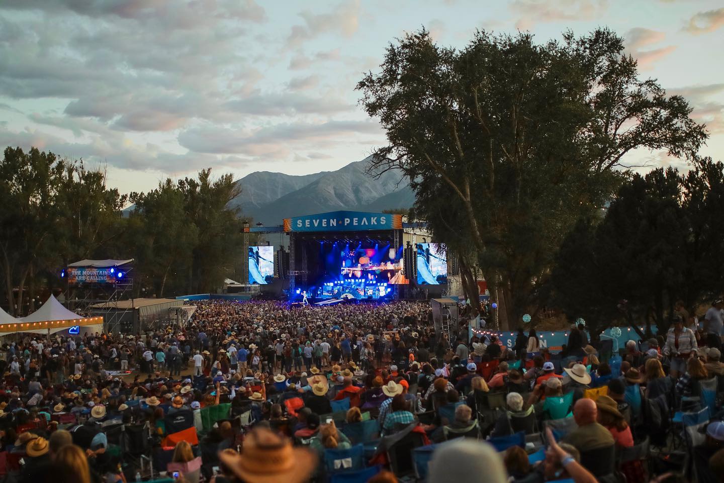 Crowd of people in front of the main stage at a music festival