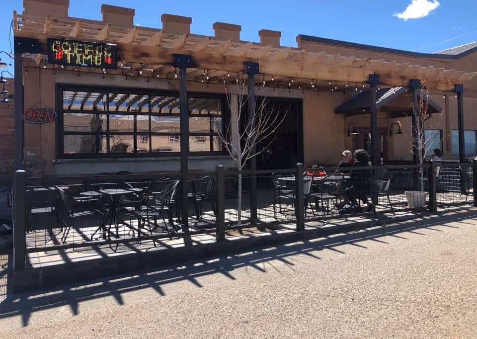 Pizza restaurant with outdoor patio seating on a sunny day