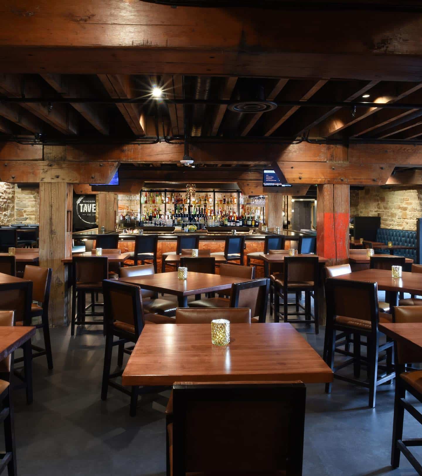 Interior of tavern restaurant with a lot of dark wood accents