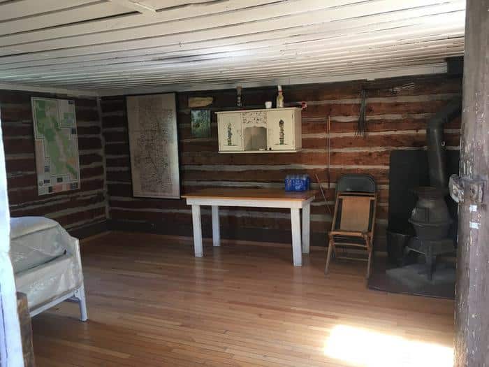 The interior of the Bassam Guard Station showing a wood burning stove in the corner