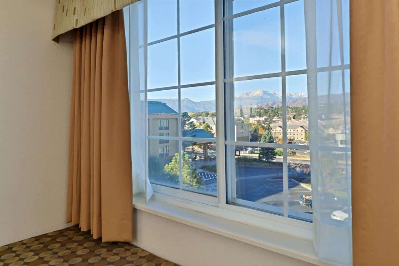 View of Pikes Peak from a window at Best Western Plus Peak Vista Inn & Suites in Colorado Springs