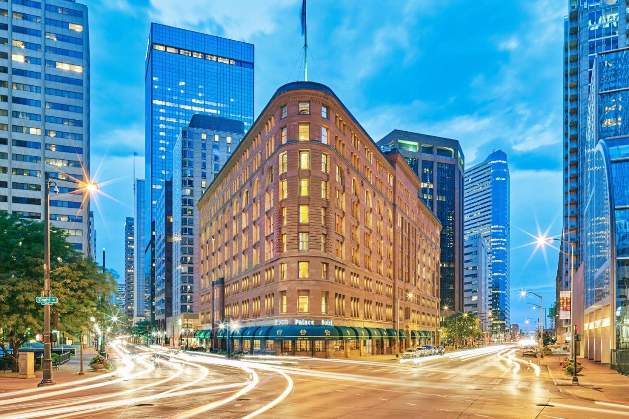 Evening lights in a time-lapse photo of the exterior of Brown Palace Hotel in downtown Denver, Colorado