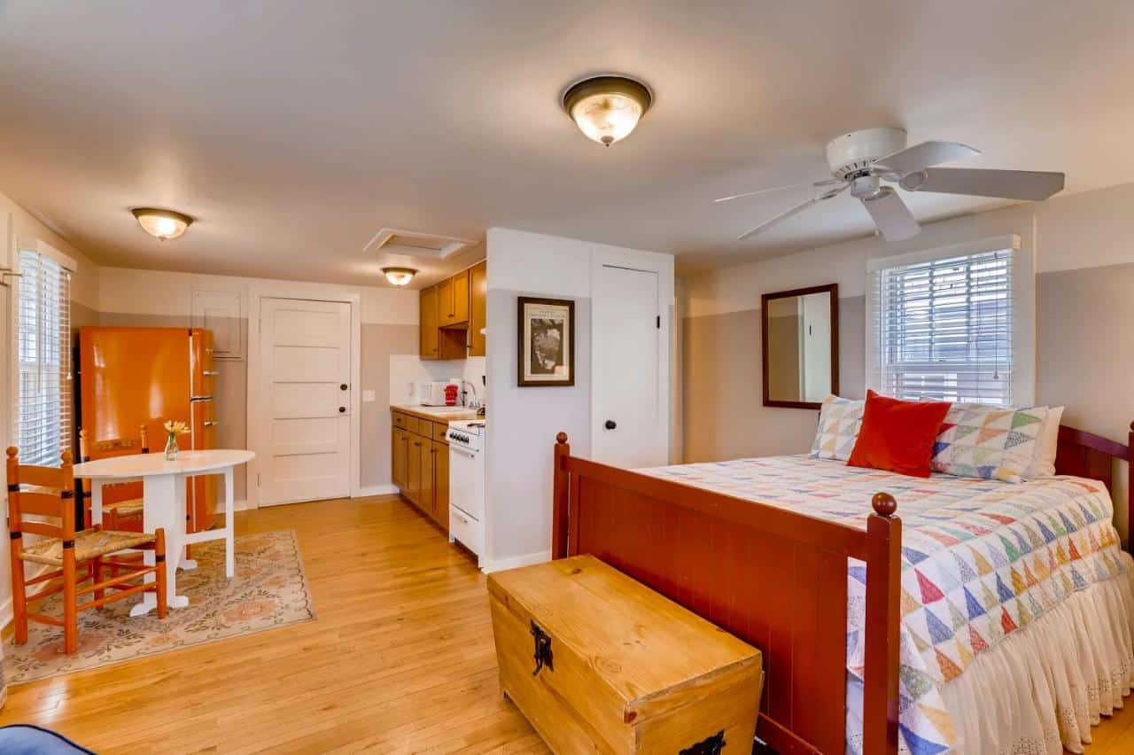 Interior of a studio cottage at Chautauqua Park showing bed and kitchen