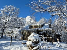 Snow covered exterior of the Colorado Chautauqua Cottages in Boulder