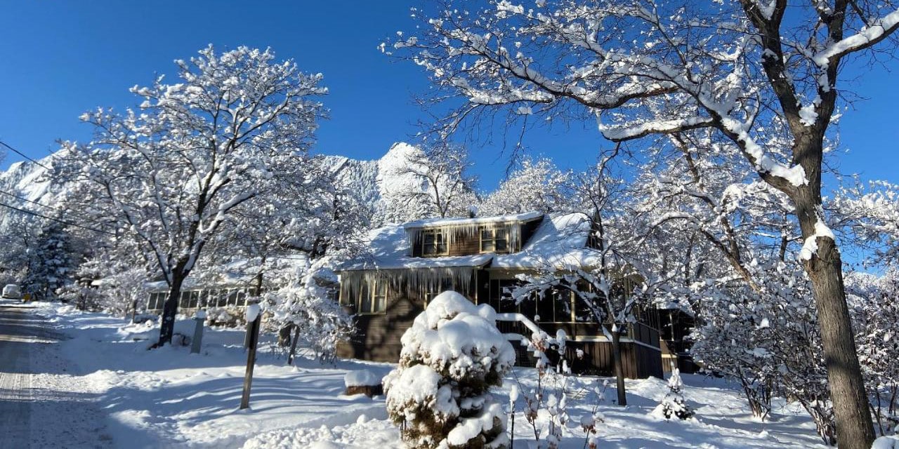 Snow covered exterior of the Colorado Chautauqua Cottages in Boulder