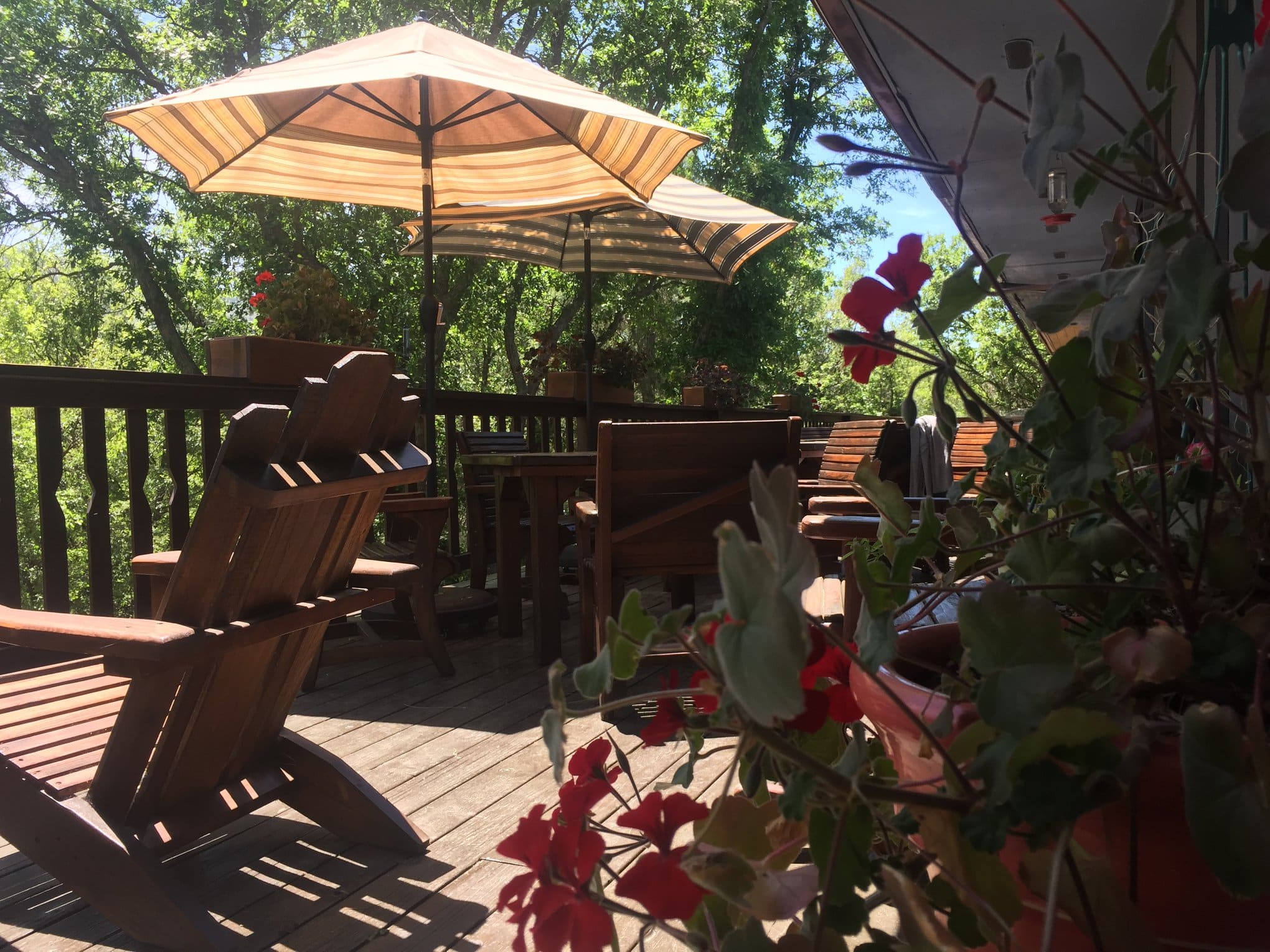 Seats and umbrellas on the deck at Country Sunshine Bed and Breakfast in Durango, Colorado