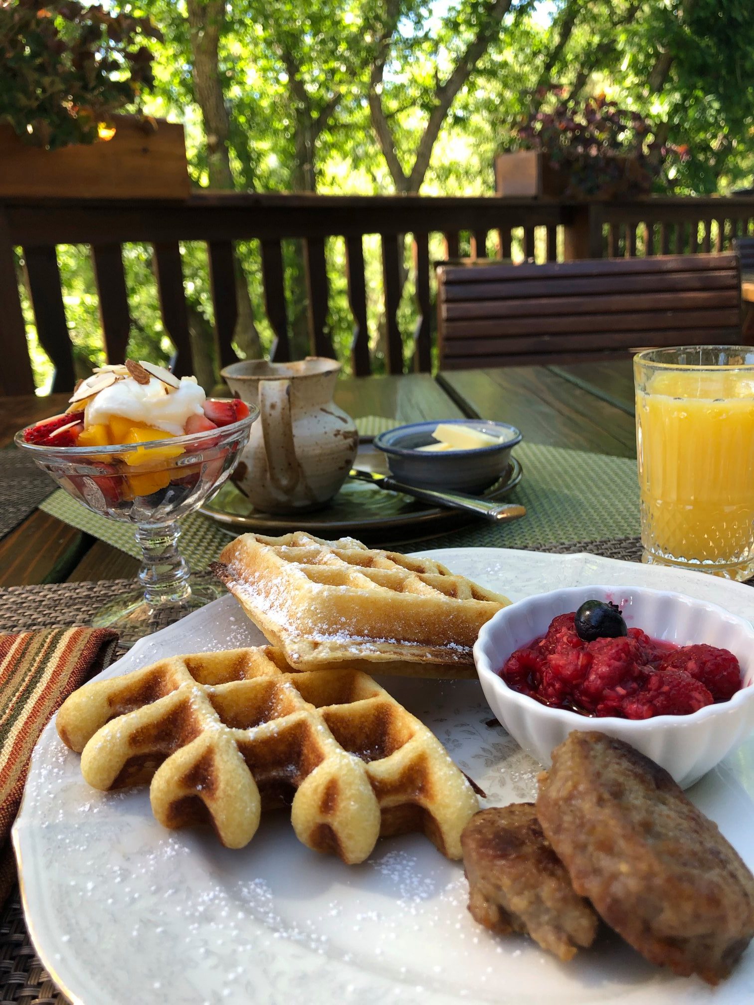 Breakfast on the deck with waffles and orange juice at the Country Sunshine Bed and Breakfast in Durango, Colorado