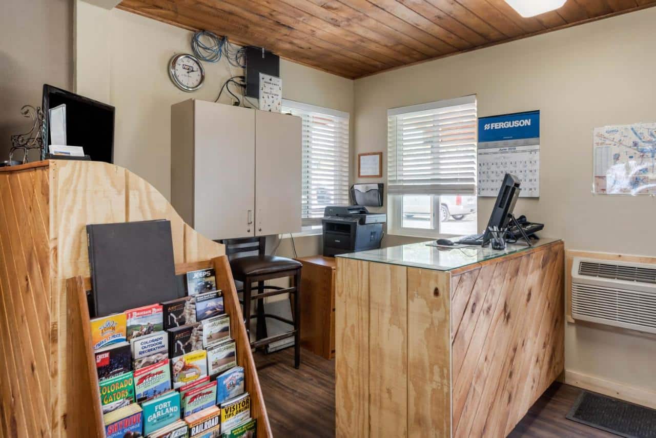 Check-in counter and activity flyers at the Great Sand Dunes Lodge