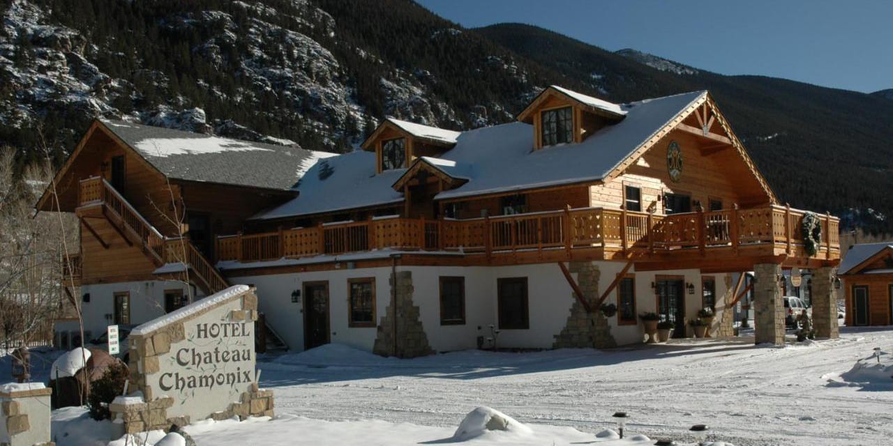 Snow on the roof and front exterior of the Hotel Chateau Chamonix in Georgetown, Colorado