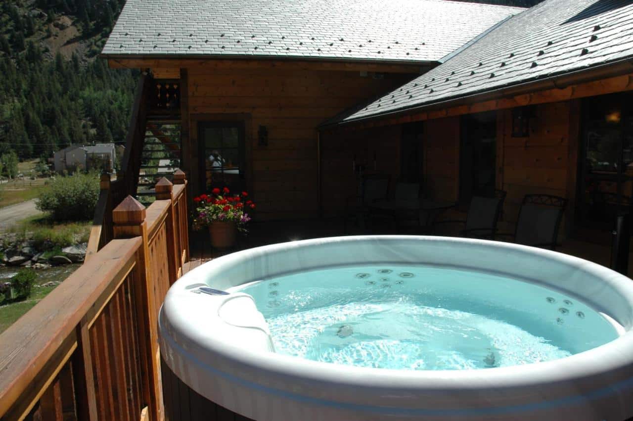 Outdoor hot tub on the balcony at Hotel Chateau Chamonix in Georgetown, Colorado