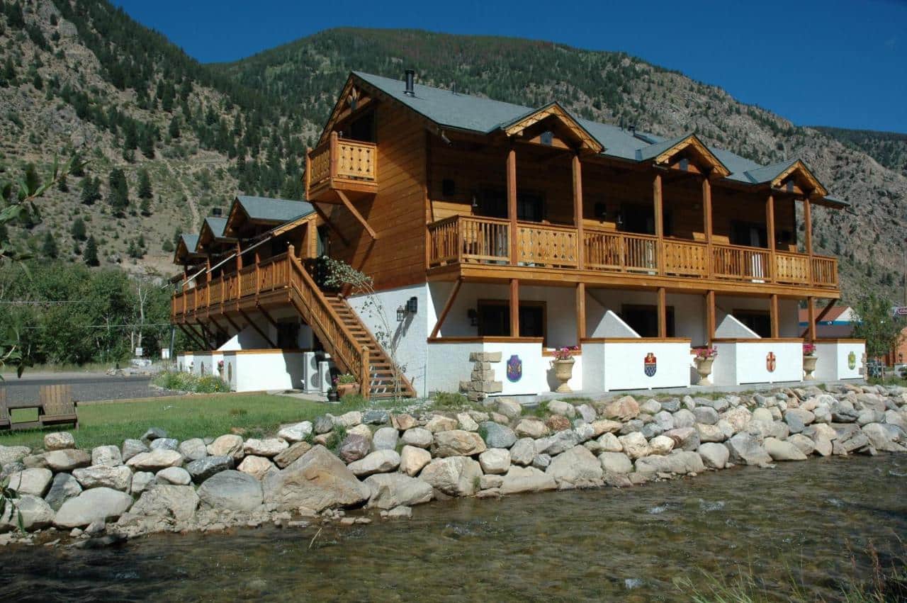 Rear riverside exterior of Hotel Chateau Chamonix in Georgetown, Colorado