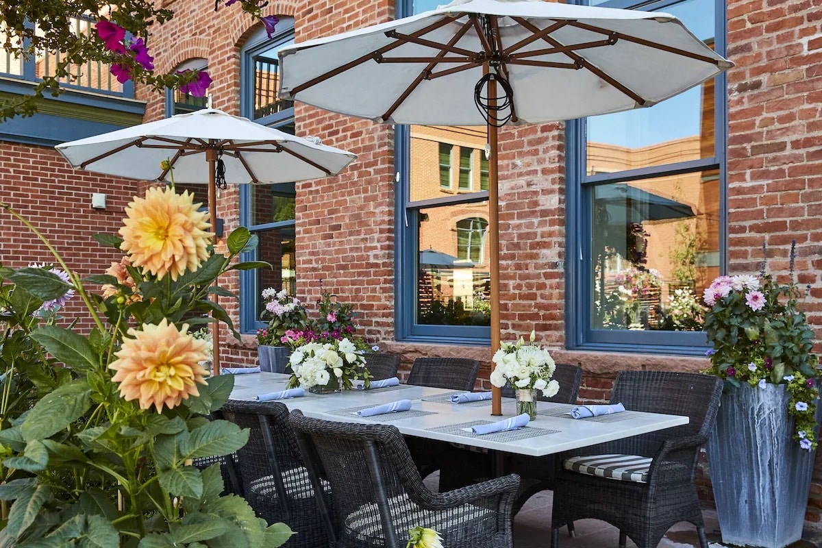 Long empty table for patio dining at Hotel Jerome