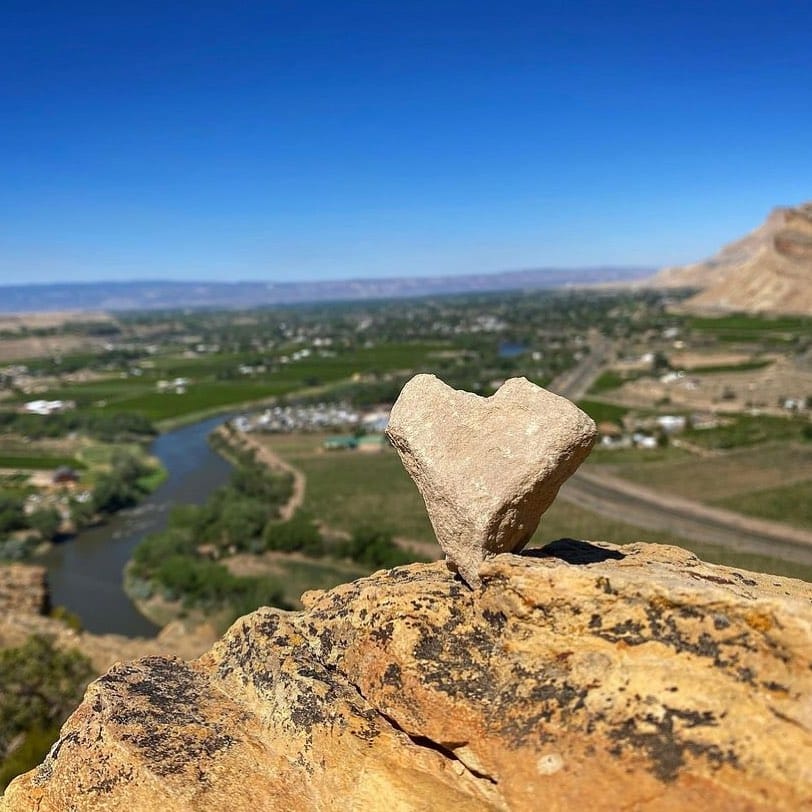 Heart shape rocked overlooking the Colorado River from high up near Palisade Basecamp RV Resort