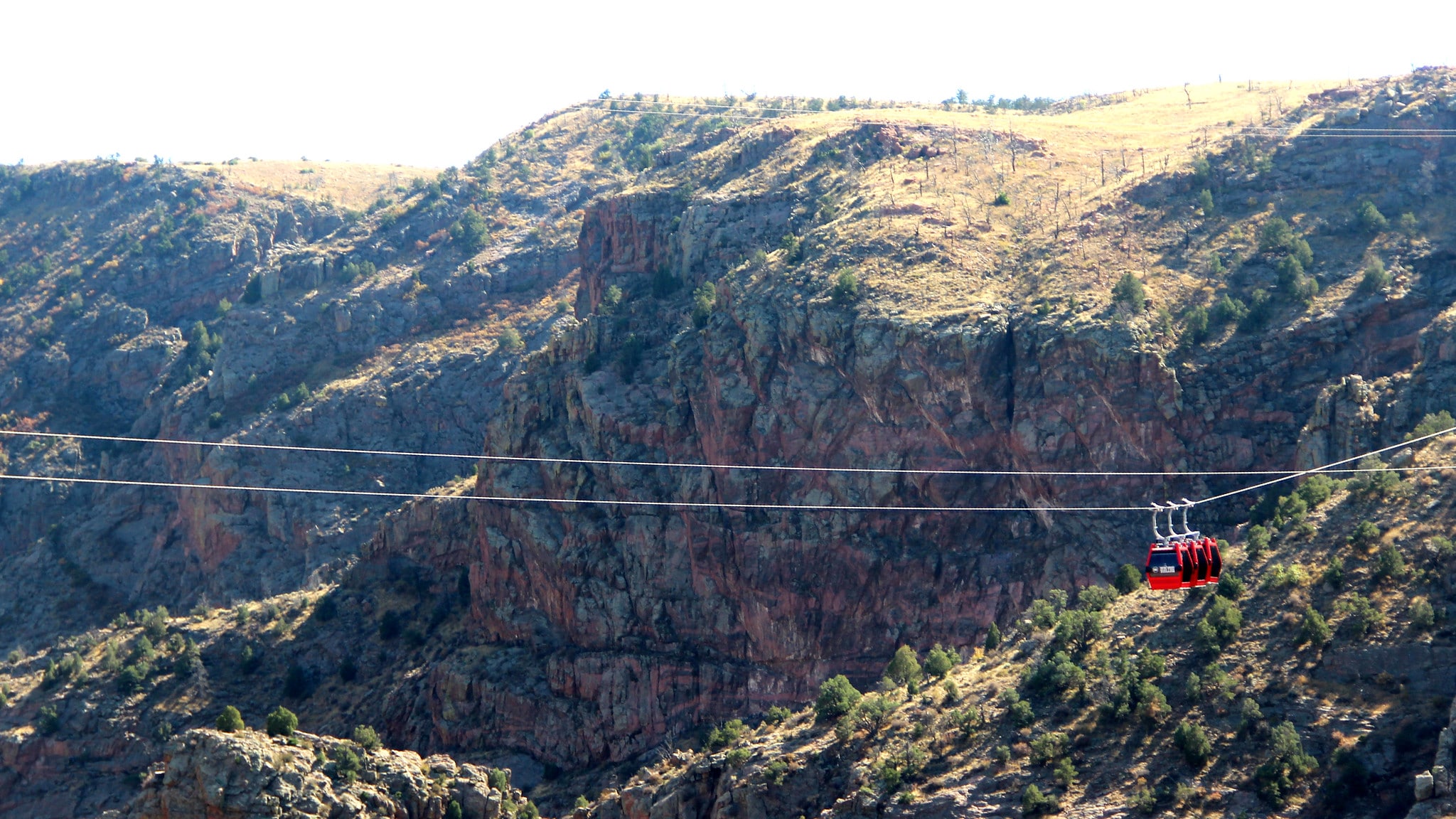 Red aerial tram car on cables over the Royal Gorge