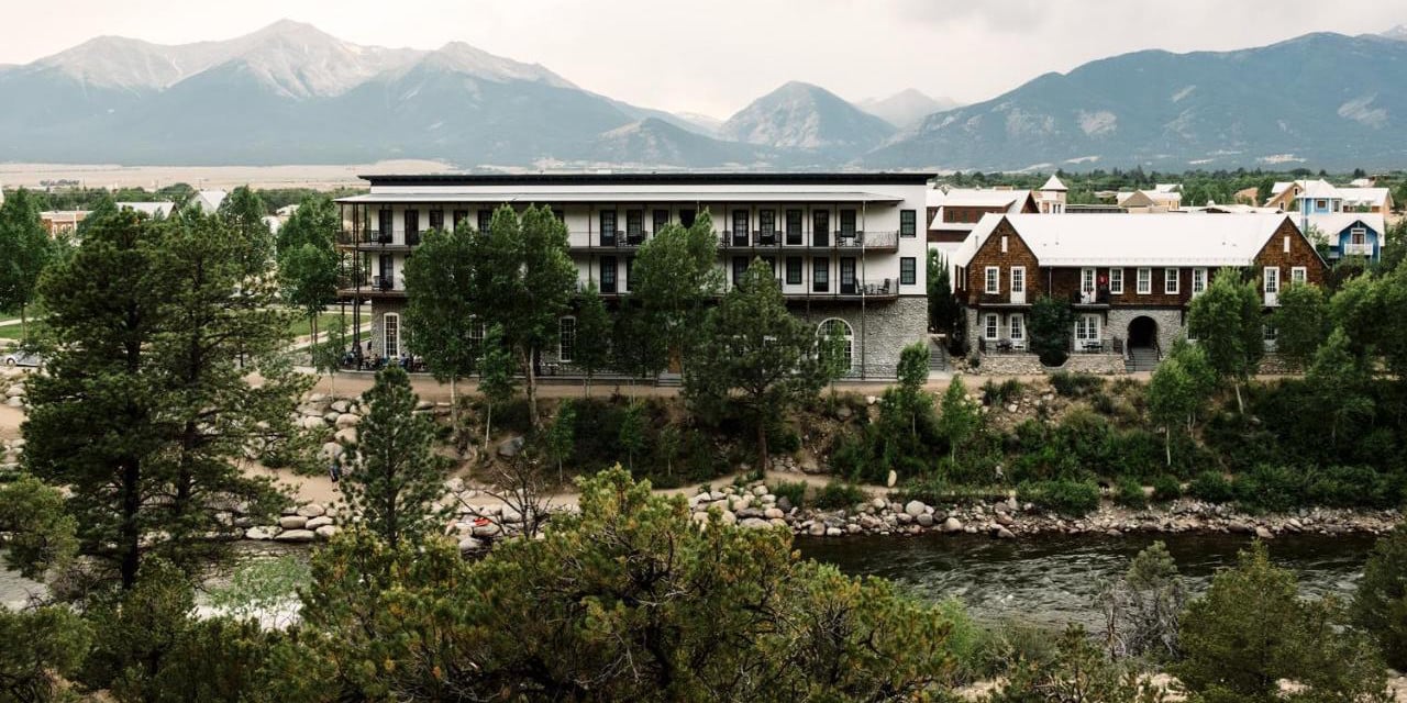 Exterior of the Surf Hotel & Chateau Buena Vista CO with view of Arkansas River and Collegiate Peaks