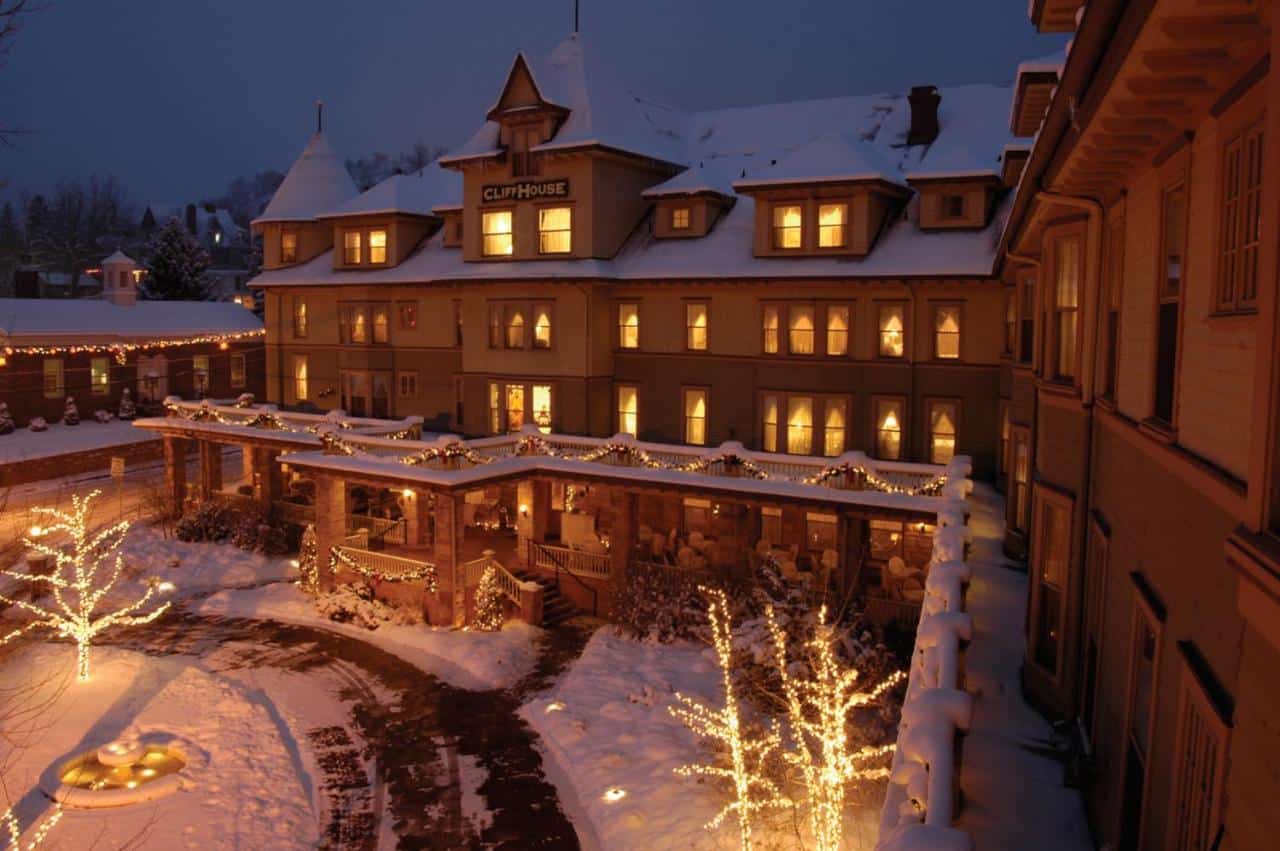 Snow-covered exterior of The Cliff House at Pikes Peak in Manitou Springs, Colorado