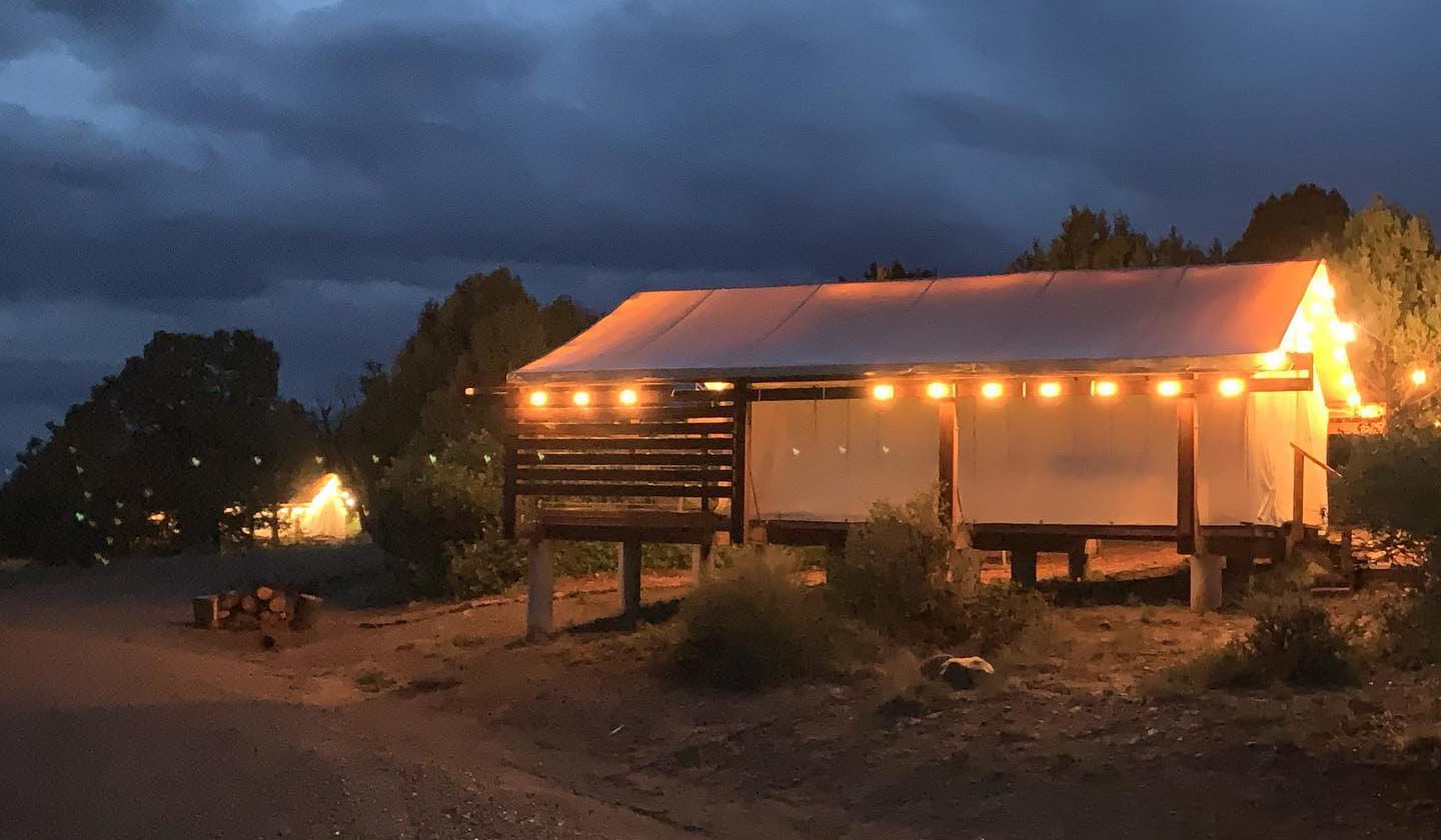 Glamping tent structure at night at The Views RV Park in Dolores, Colorado