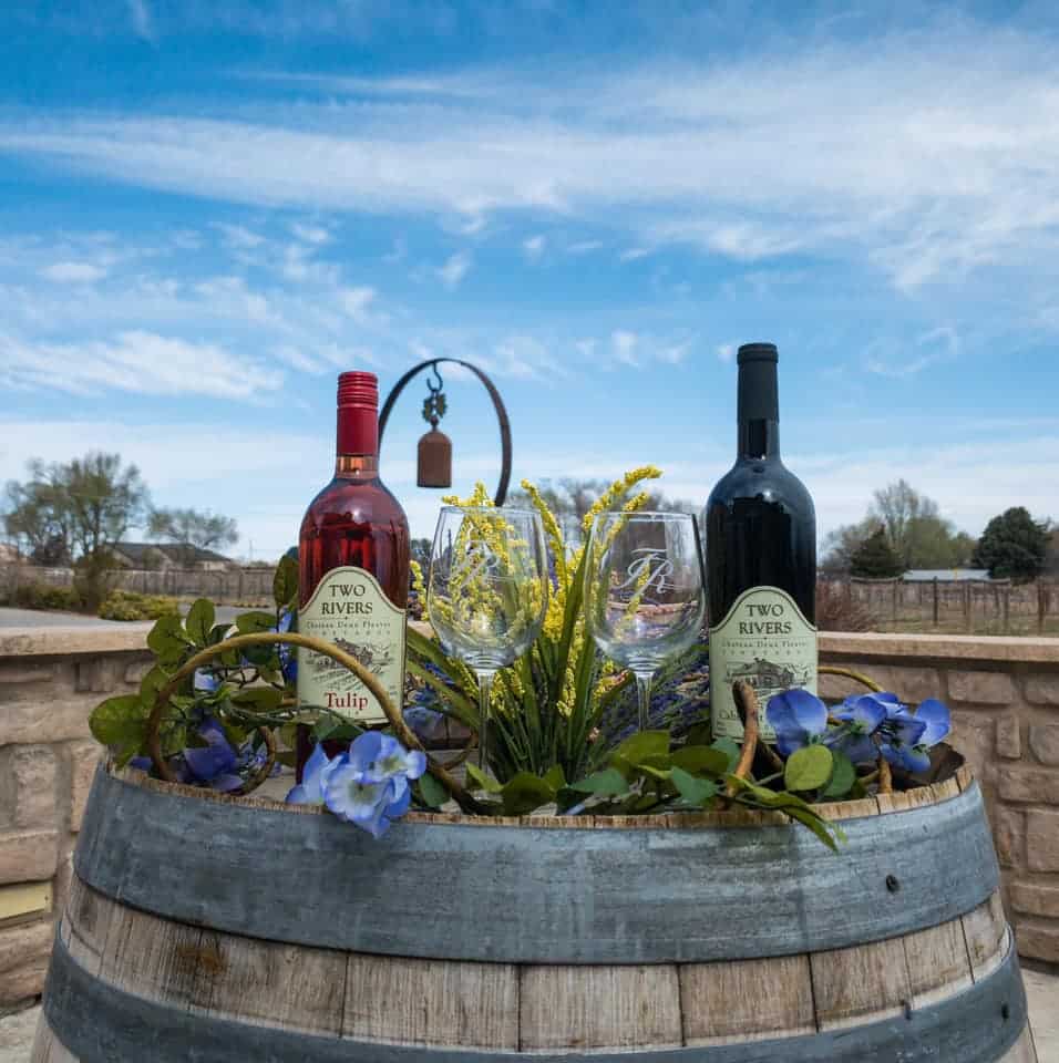 2 bottles of wine on a barrel outside the Two Rivers Winery and Chateau in Grand Junction, Colorado