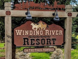 Welcome sign for Winding River Resort and On Trail Rentals in Grand Lake, Colorado