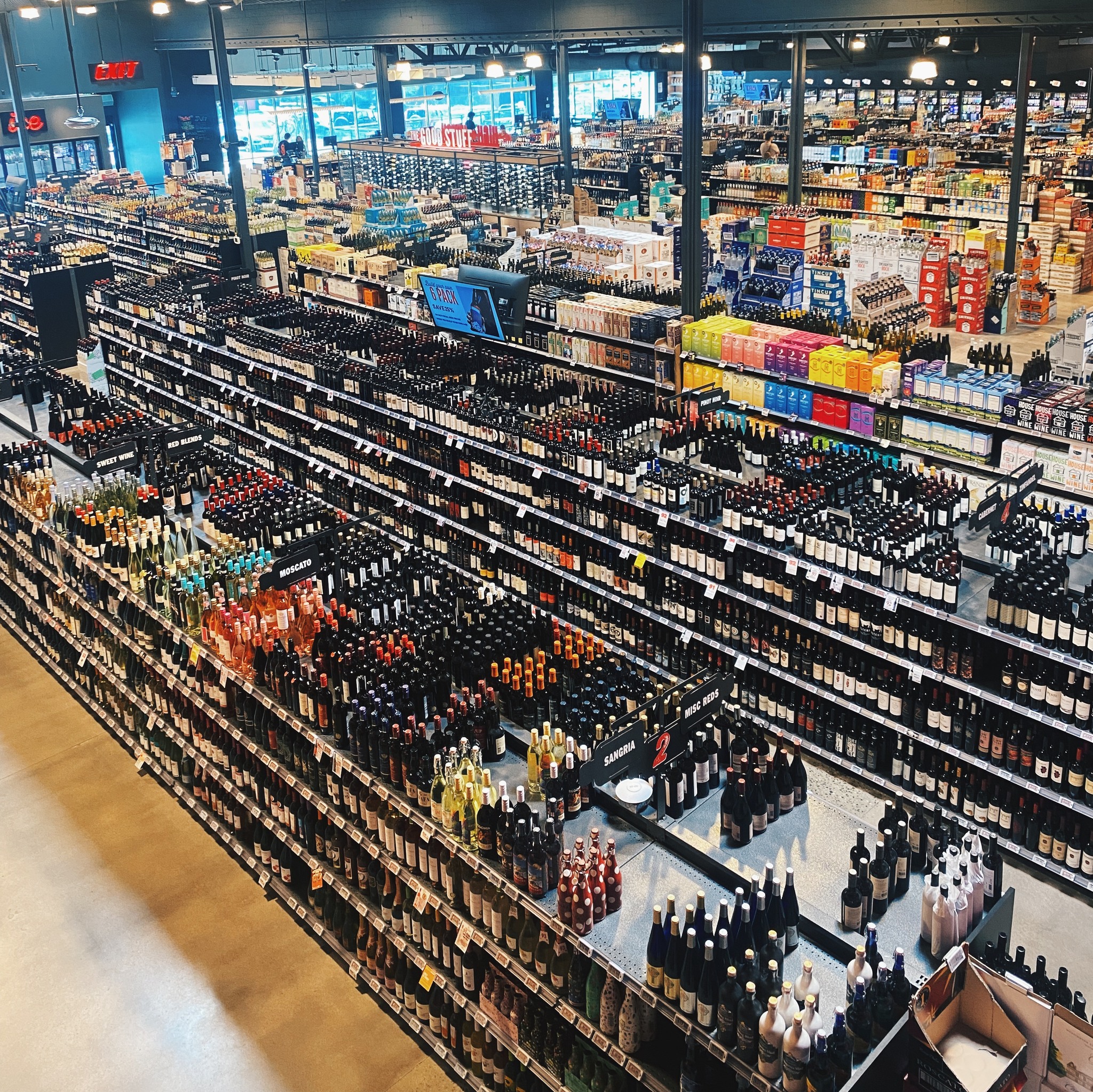 Picture of the interior of a Molly's Spirits location in Colorado. Overhead view of the massive selection of wine and spirits