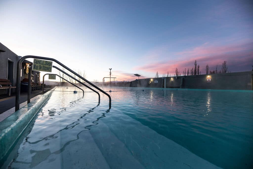 Sand Dunes Recreation Pool near Mosca. Reflection of the entry rails into the pool as the sun sets