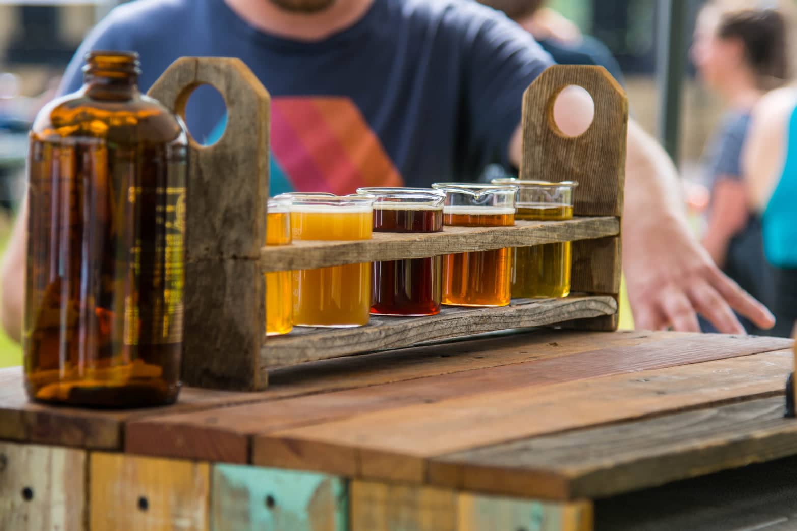 Wooden carrier for a flight of 4 small beers at the Vail Valley Brew'Au even held annually in Avon.