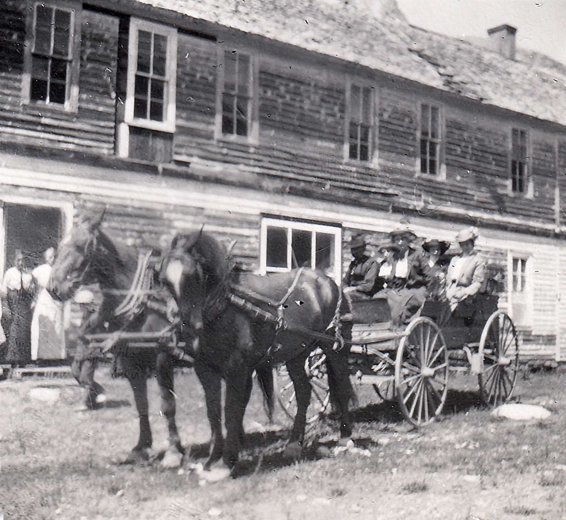 people on a horse wagon in Gothic, Colorado, circa 1915.