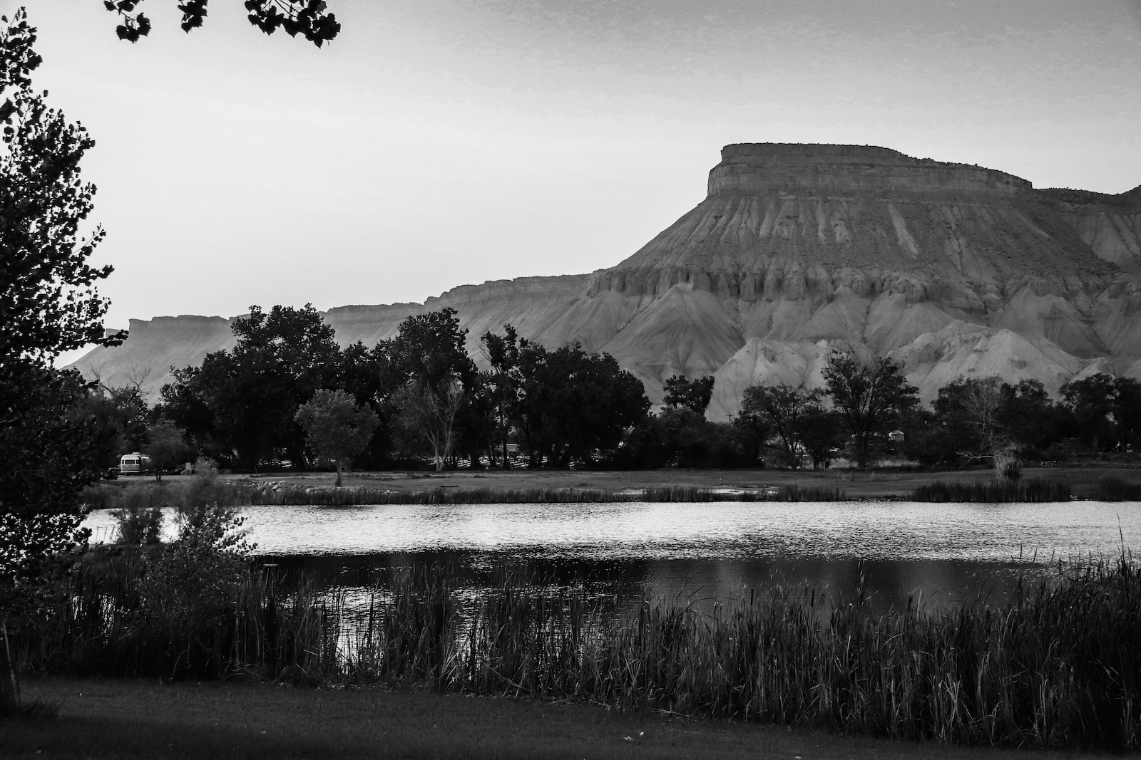 black and white photo of a lake in front of Mount Garfield