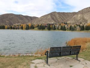 Empty bench lakeside at Nottingham Lake in Avon, Colorado