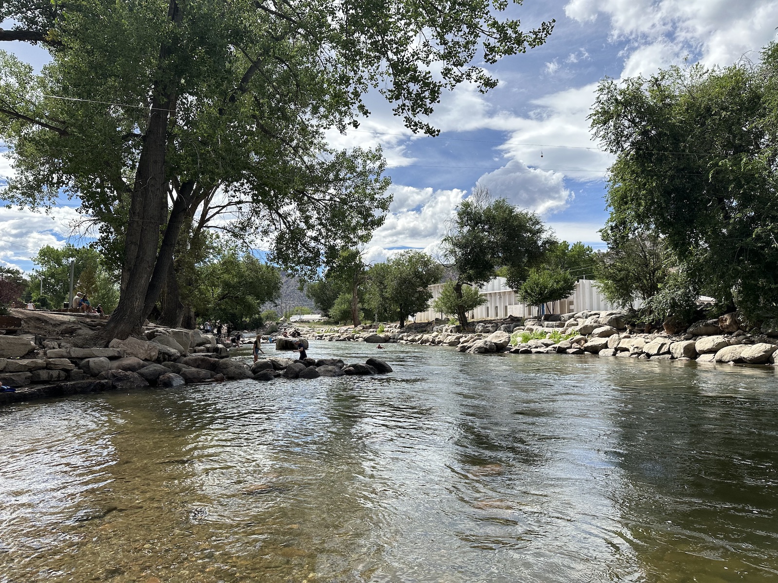 People play in the Arkansas River at the Canon City Whitewater Park