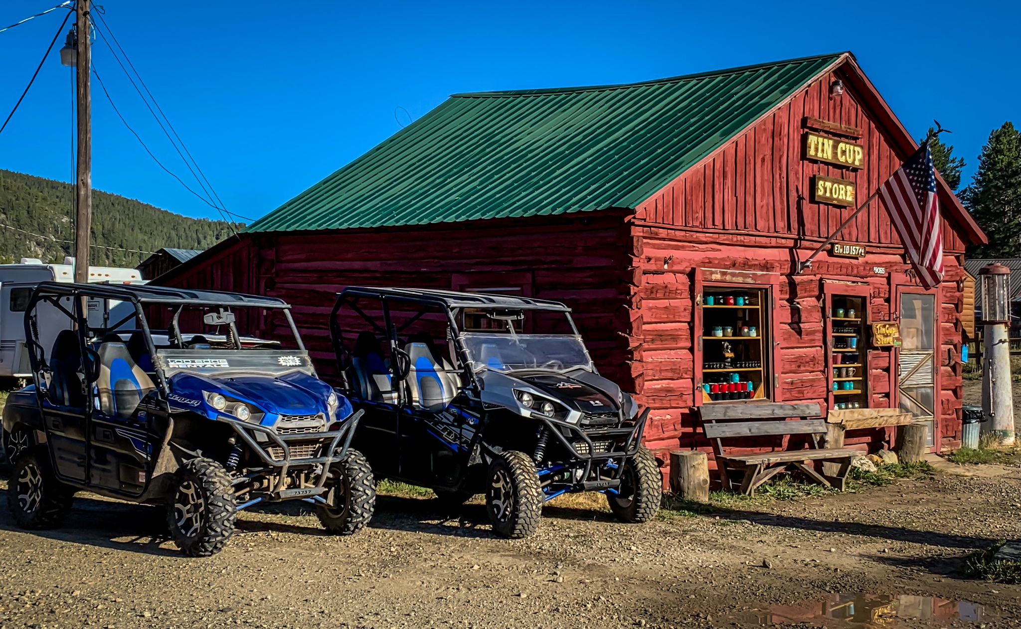 ATVs parked next to an old store in Tincup, Colorado
