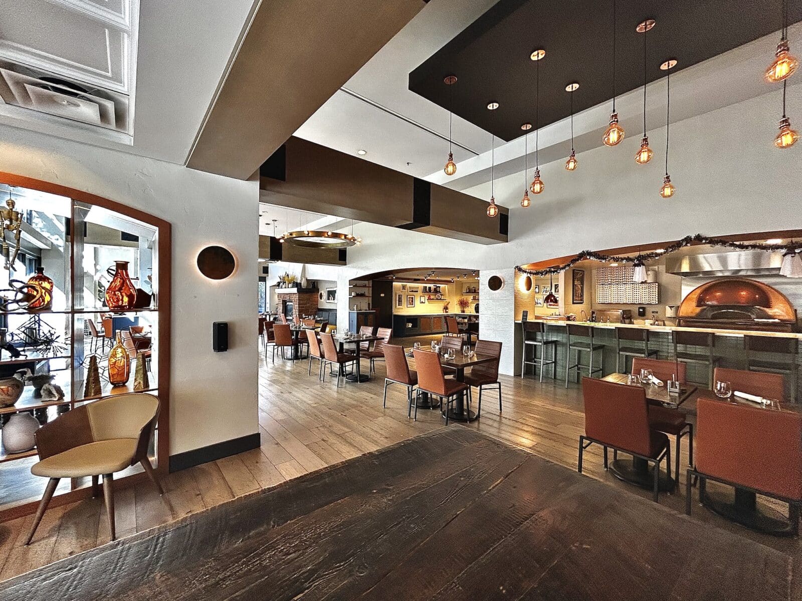 dining tables and bar inside Gattara in Denver