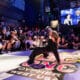 The image captures A+ dancing in the championship round of Red Bull BC One Denver West Cypher in 2024