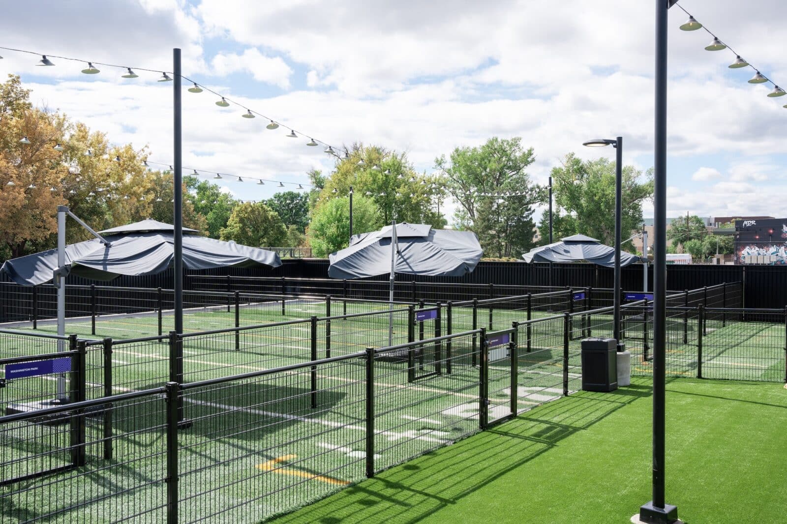 Fenced in turf areas outside at Skiptown in RiNo in Denver