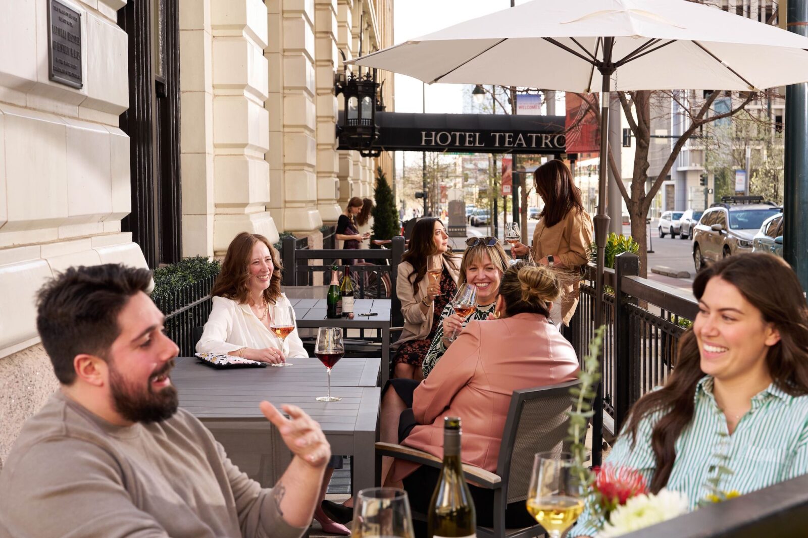 people relax on the patio and sip drinks at The Nickel in Downtown Denver