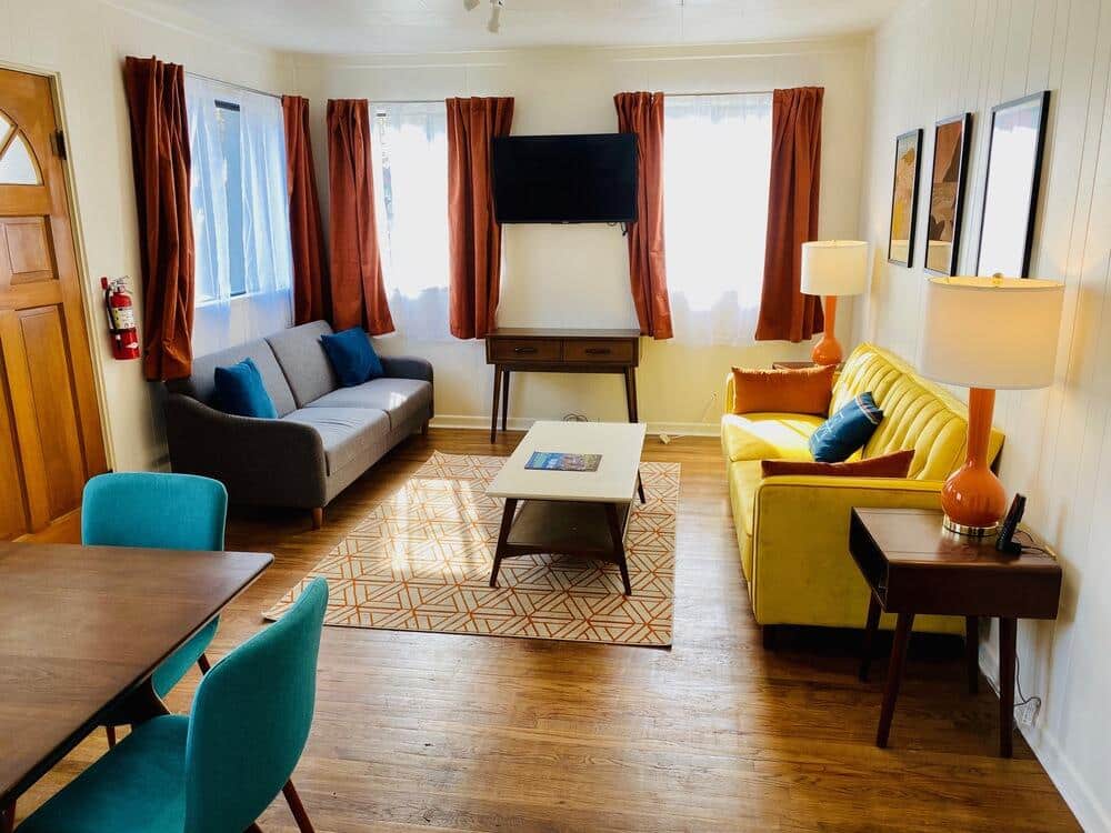 Community room with couches and TV at A-Lodge Lyons