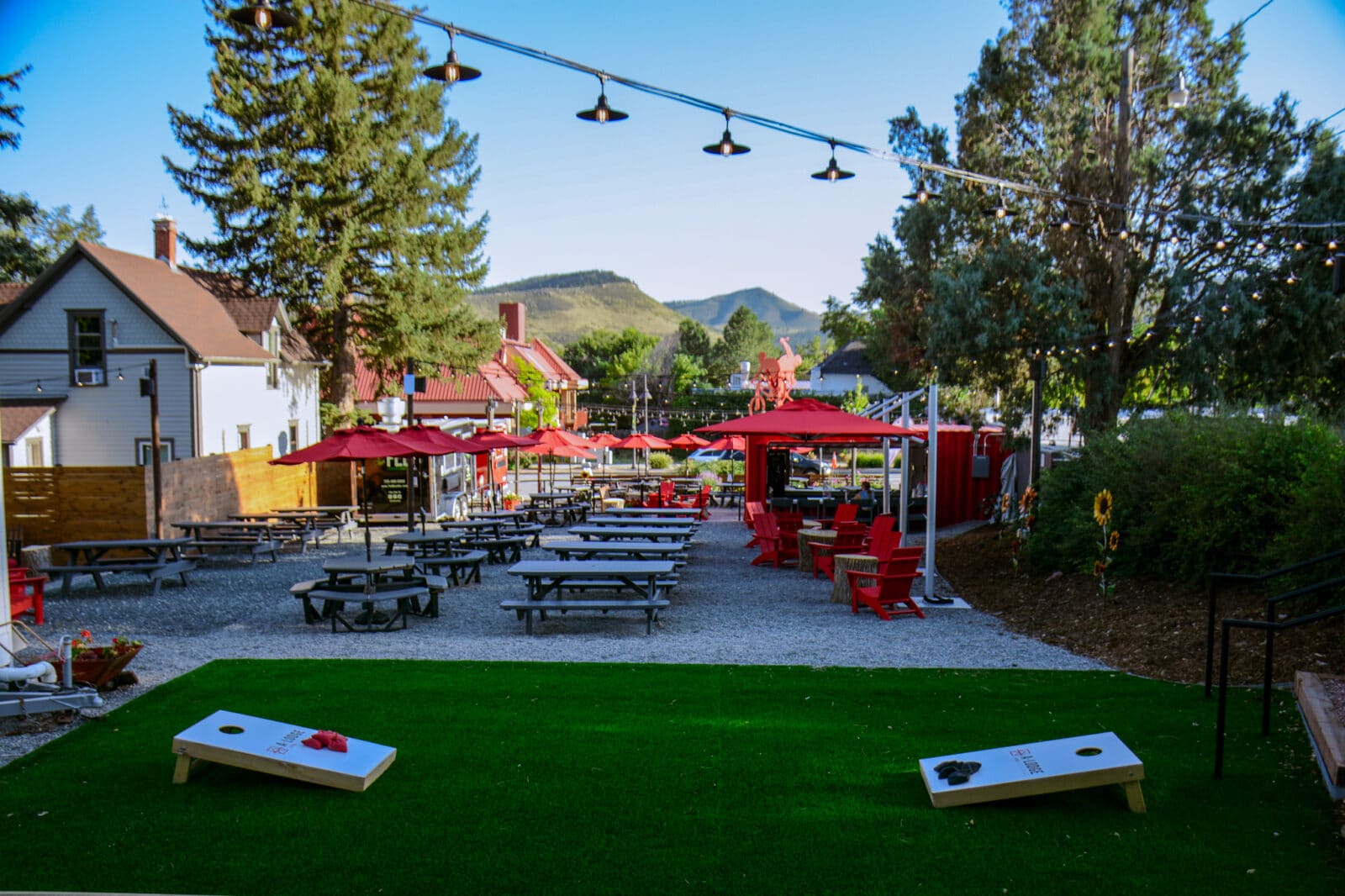 Cornhole bagtoss game and patio seating at A-Lodge Lyons