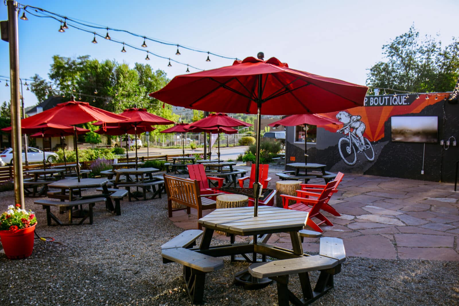 Picnic tables with red umbrellas at A-Lodge Lyons
