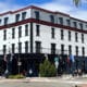 Exterior of Hotel St. Cloud in spring during daytime