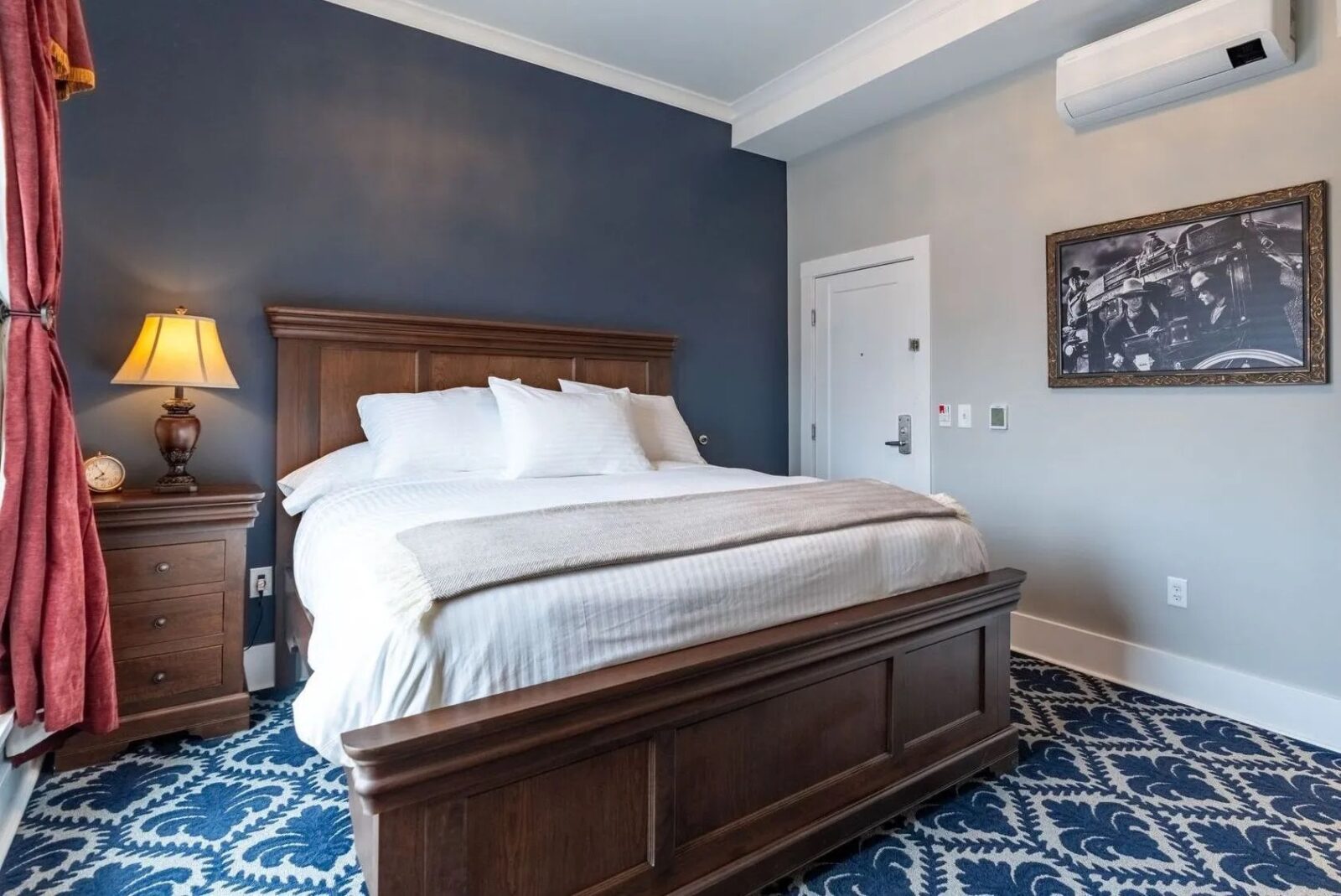 hotel room with queen bed inside Hotel St. Cloud in Canon City