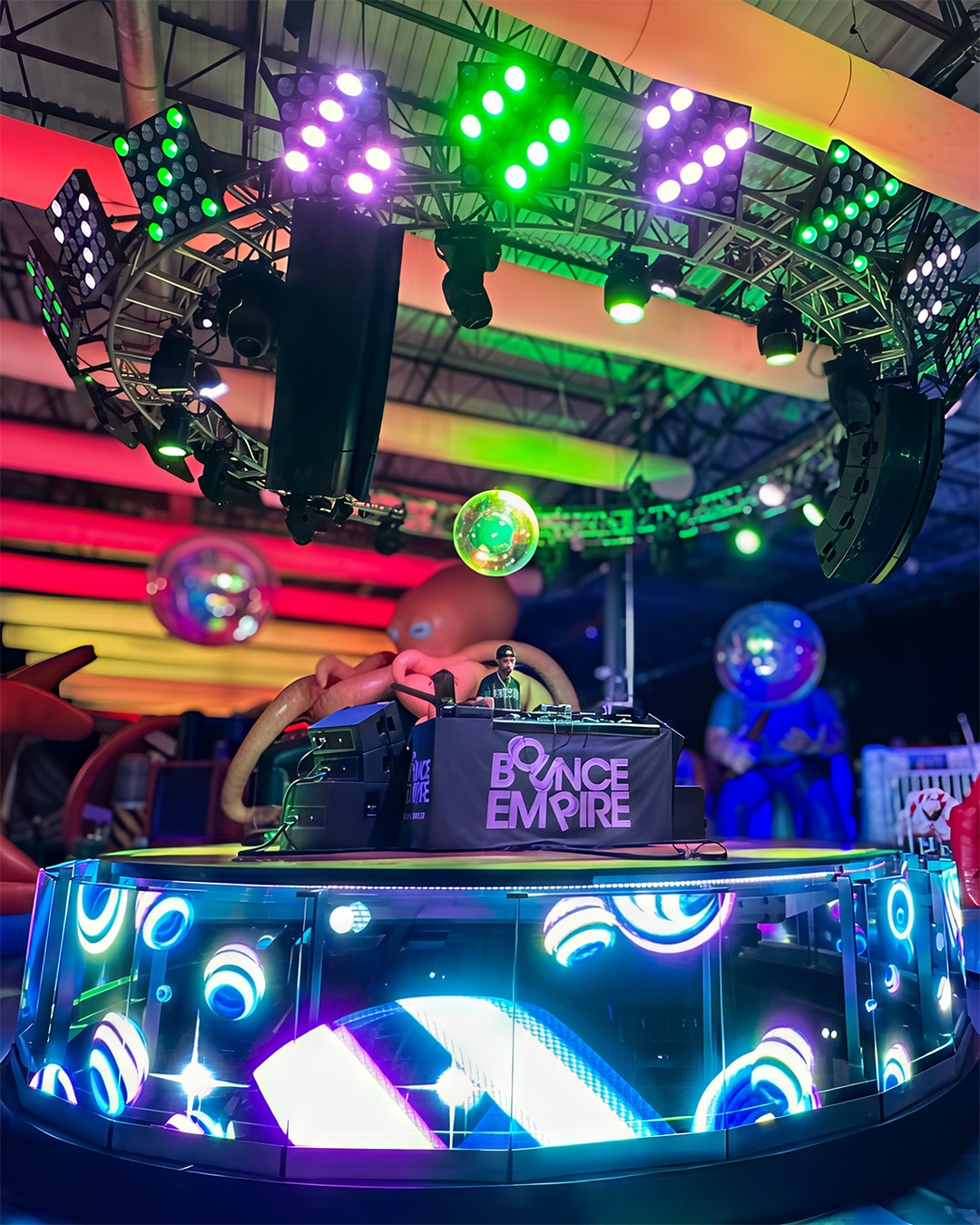 man DJing on stage at Bounce Empire in Lafayette
