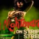 woman kneels in martini glass for Nightmare on Strip Street: A Burlesque Parody